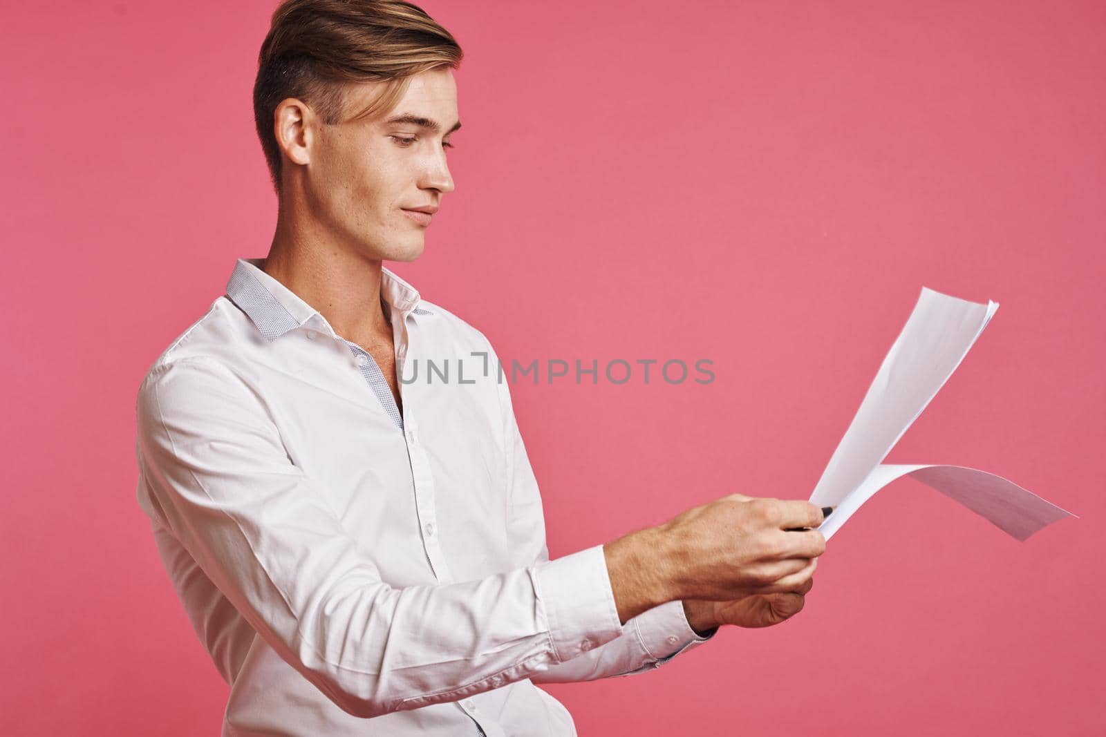 portrait of a man reading documents in hand isolated background. High quality photo