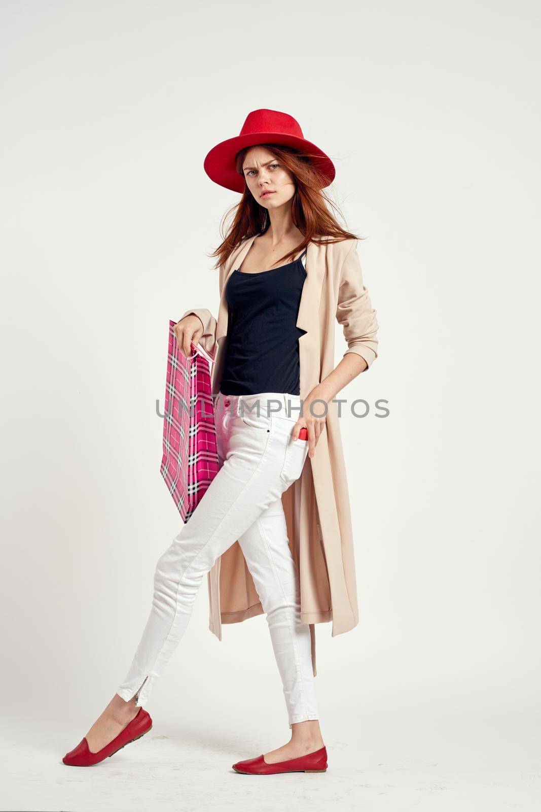 cheerful woman wearing a red hat posing shopping fun isolated background. High quality photo