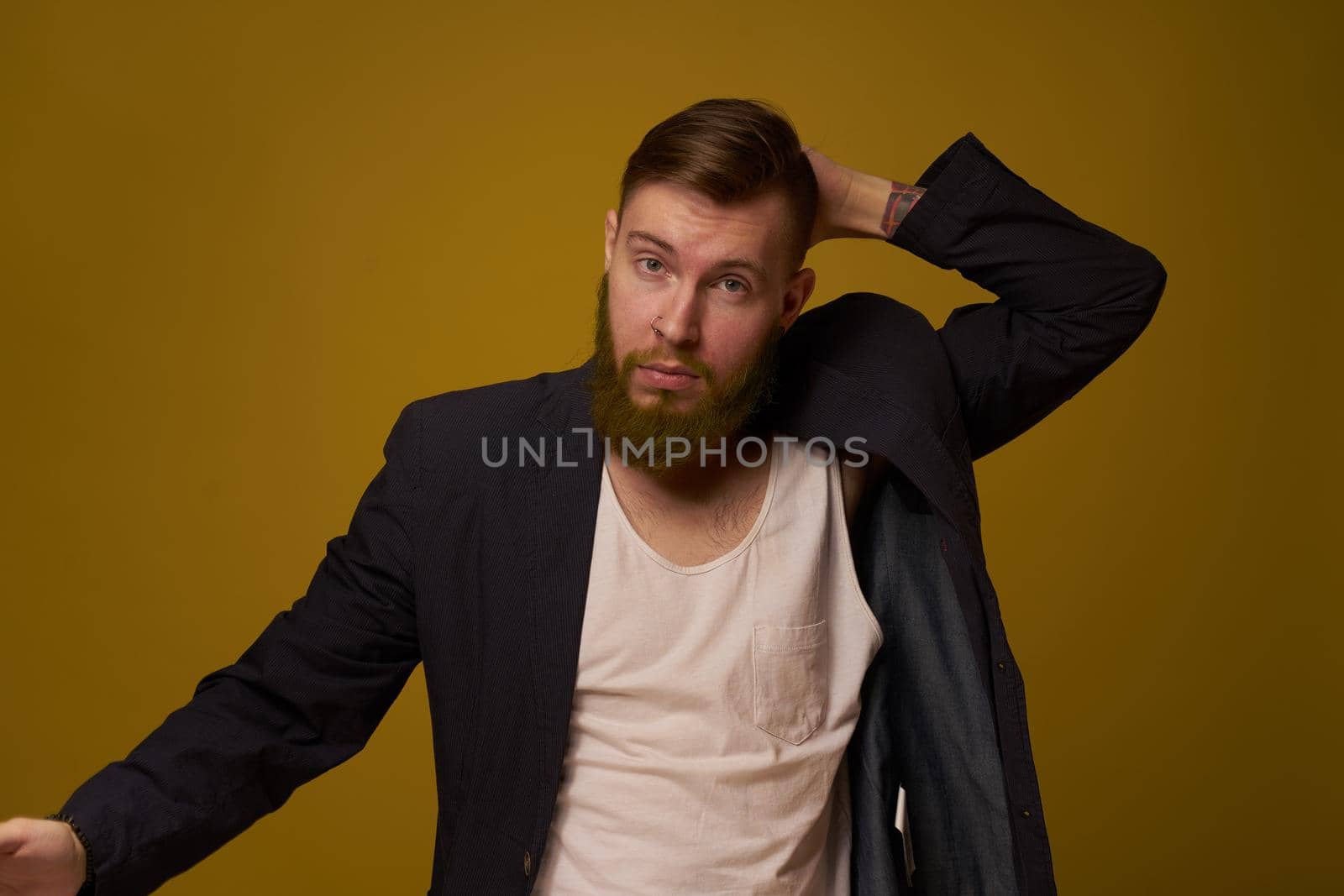 bearded man fashionable hairstyle jacket posing self confidence by Vichizh