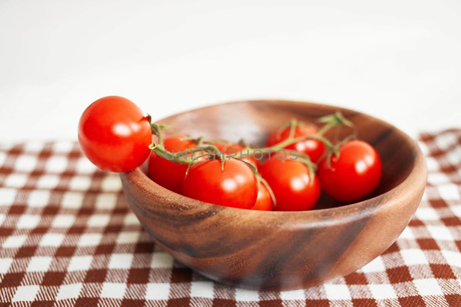 Ingredients Cherry tomatoes on a cutting board wood background. High quality photo