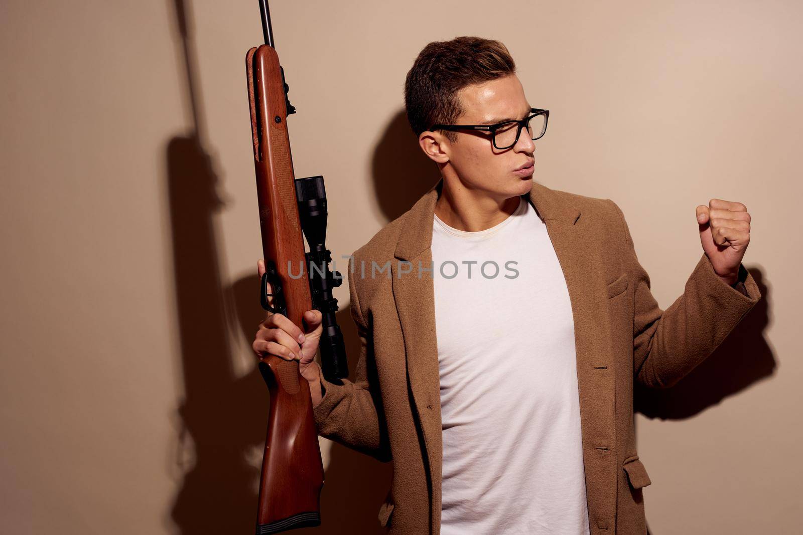 portrait of a man Gangster aggression crime shooting studio lifestyle. High quality photo
