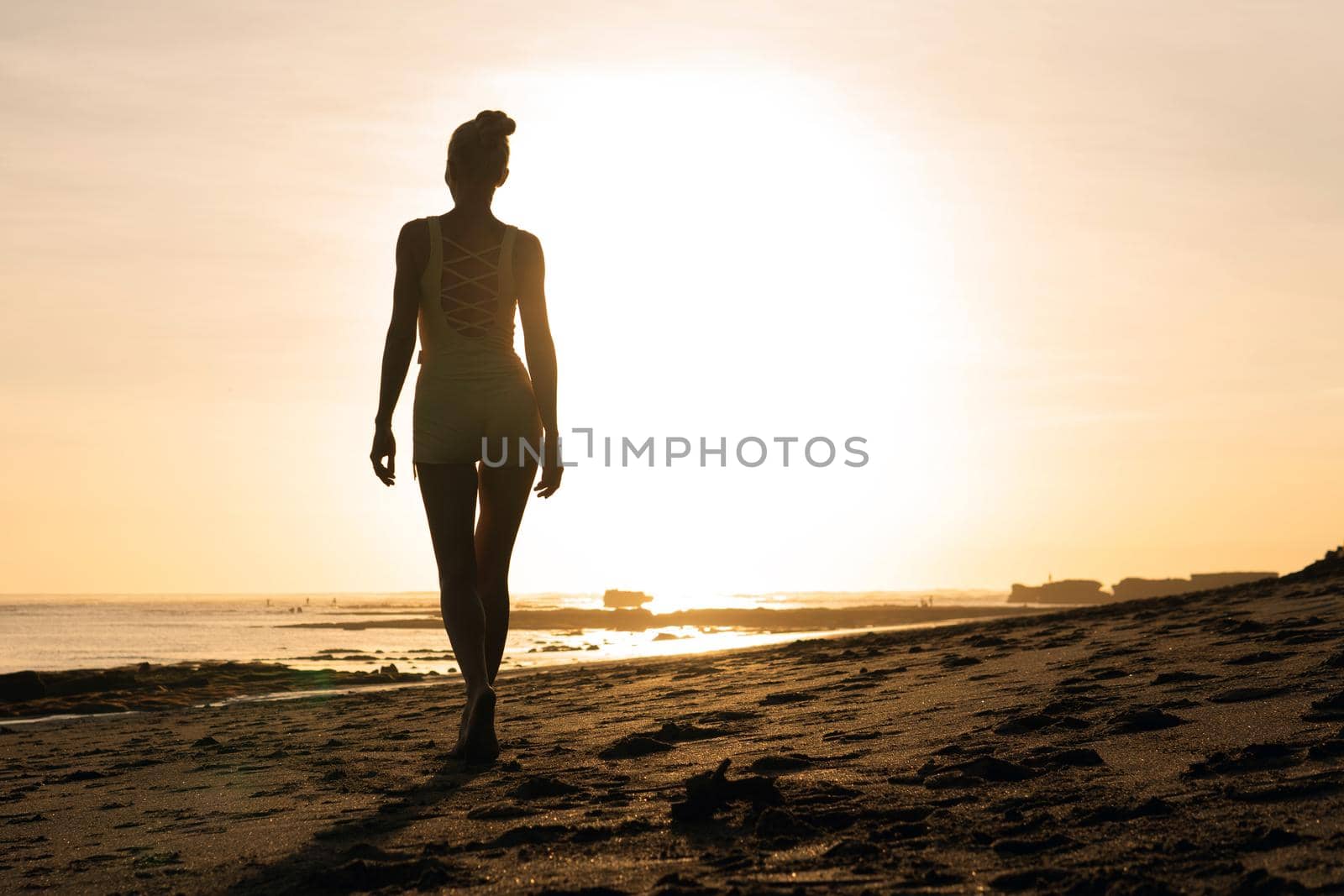 beautiful girl walking on the beach. bali