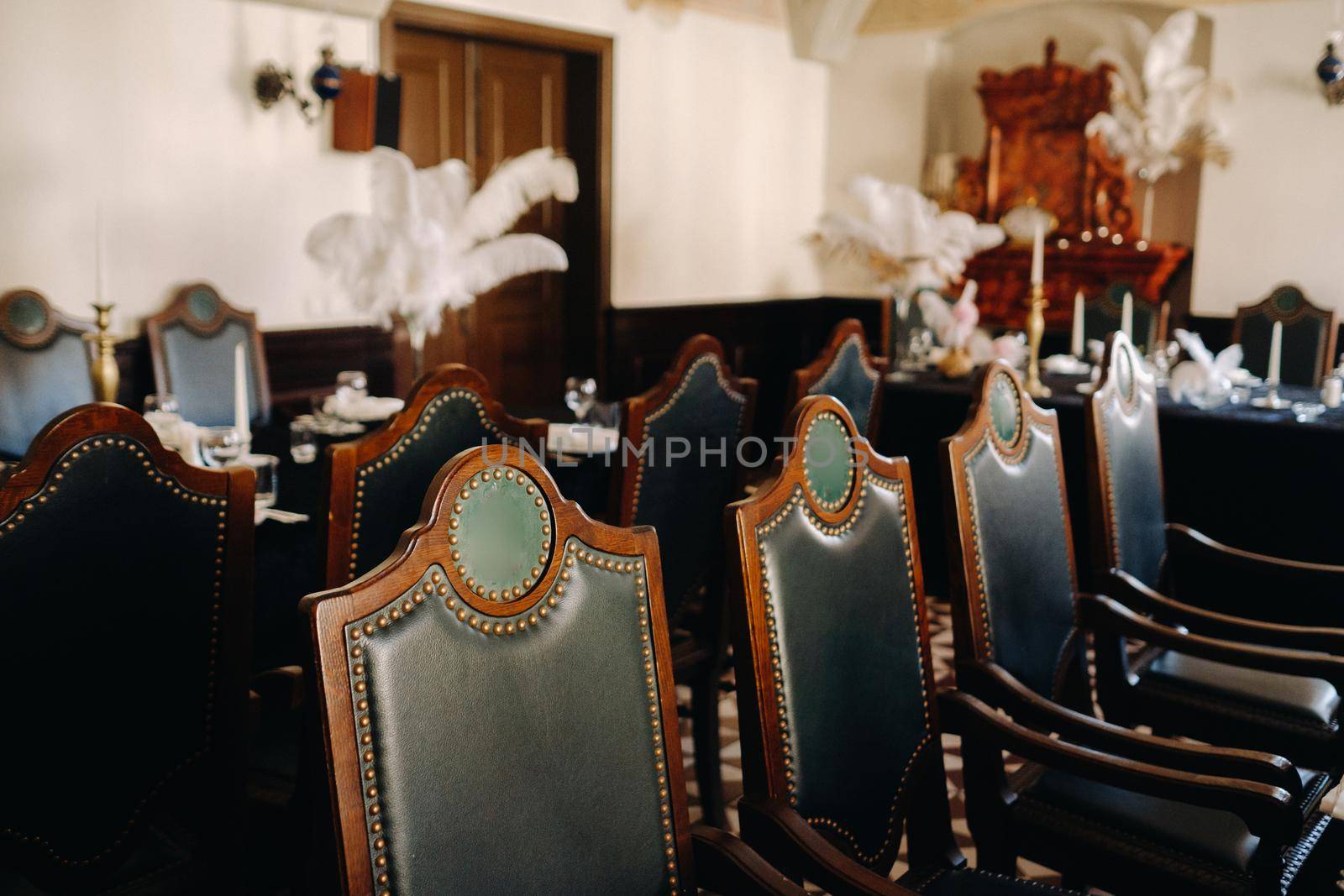 Antique chairs for a wedding evening in the restaurant of an old castle.