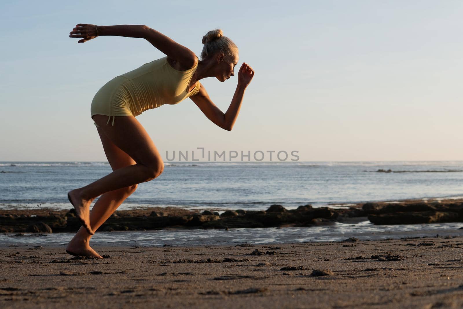 beautiful woman jogging on the beach. bali