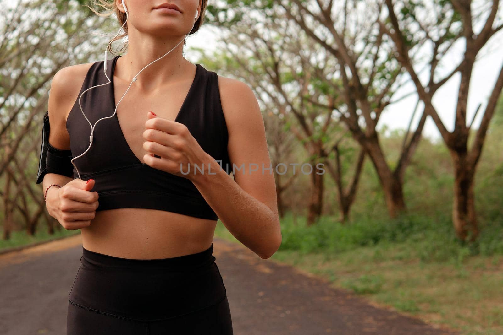 Beautiful girl go in for sports. autumn by Alexzhilkin