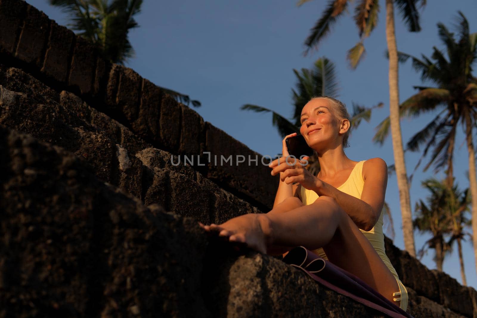 beautiful woman posing on the stones. bali