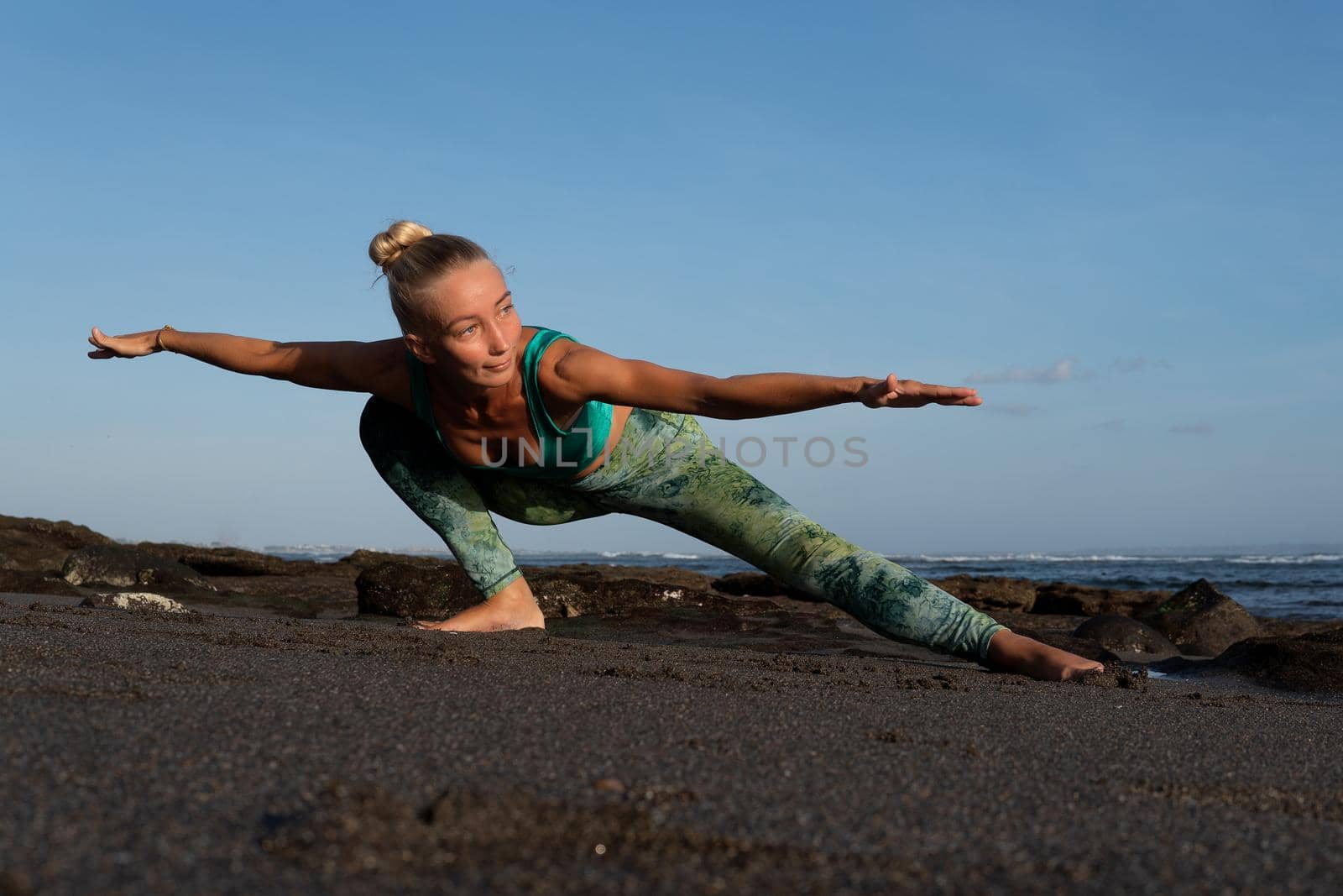 beautiful woman doing yoga on the beach. Bali