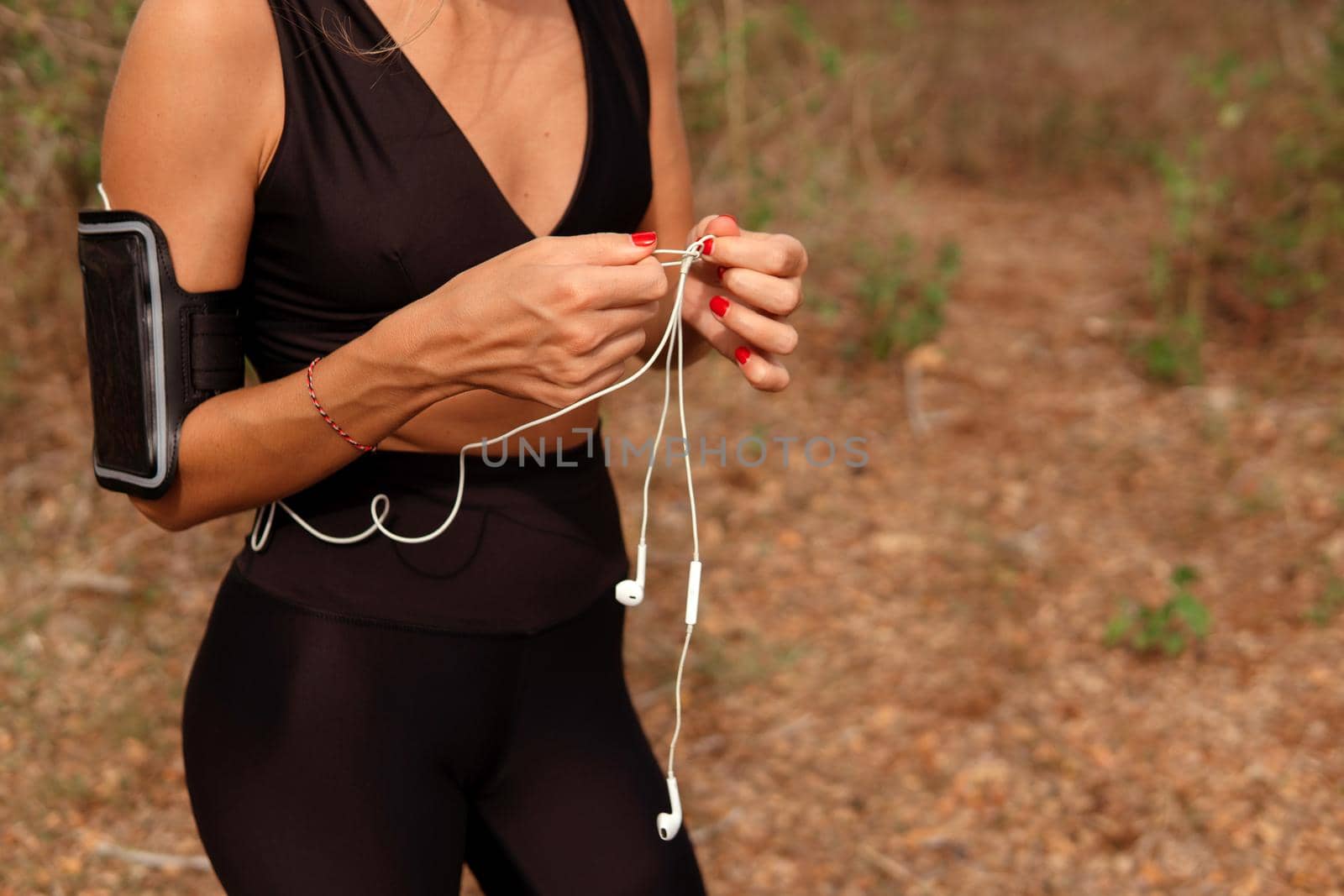 beautiful woman listening to music in the park