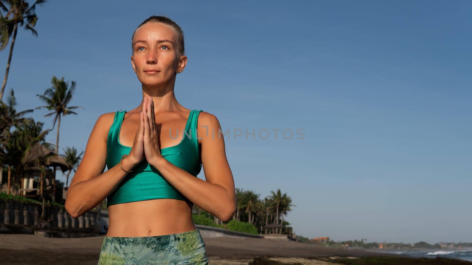 beautiful woman doing yoga by Alexzhilkin