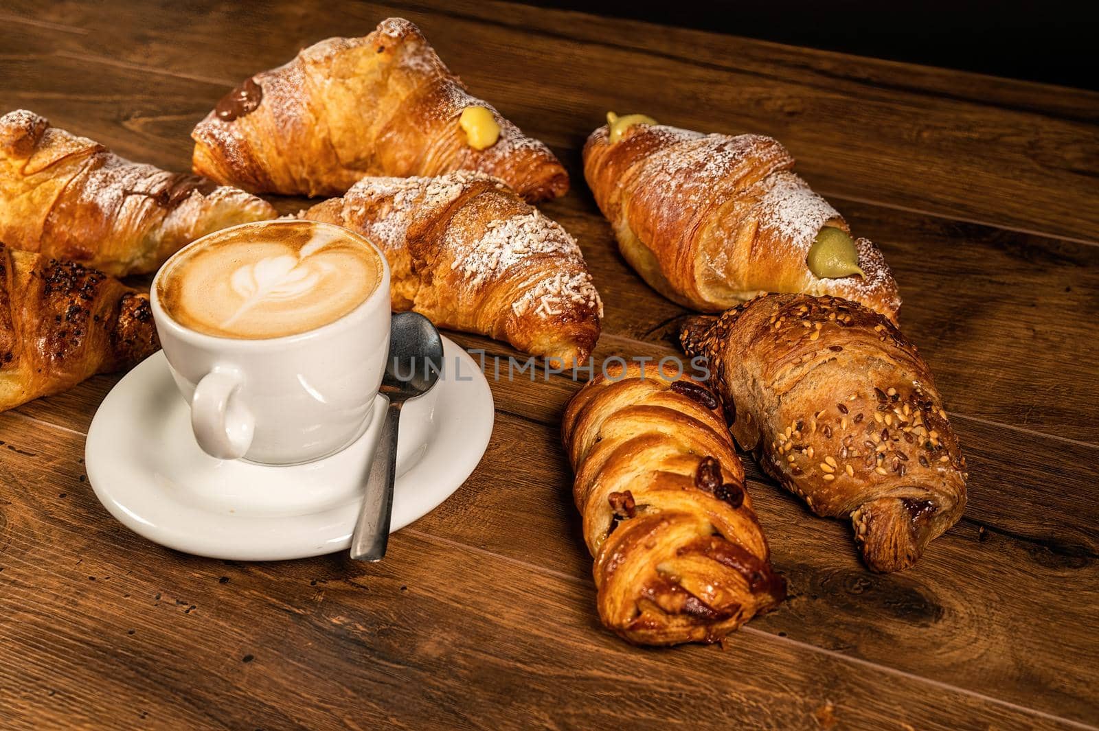 sweet croissants with cream and cappuccino by carfedeph