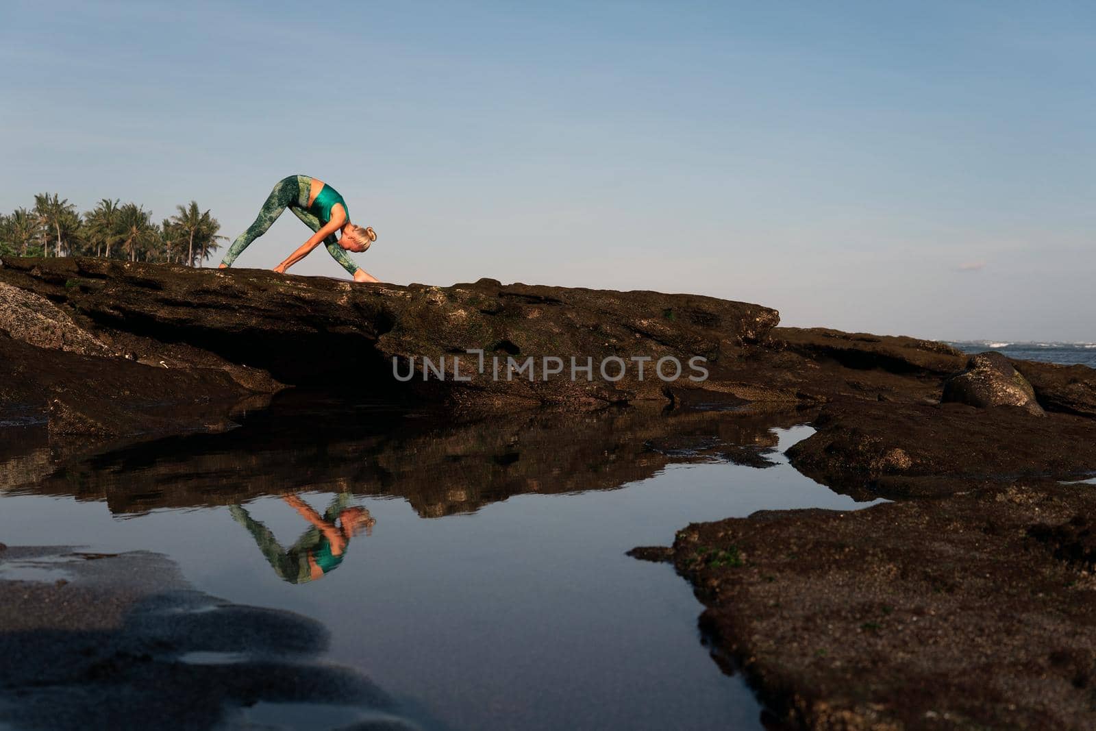 beautiful woman doing yoga by Alexzhilkin