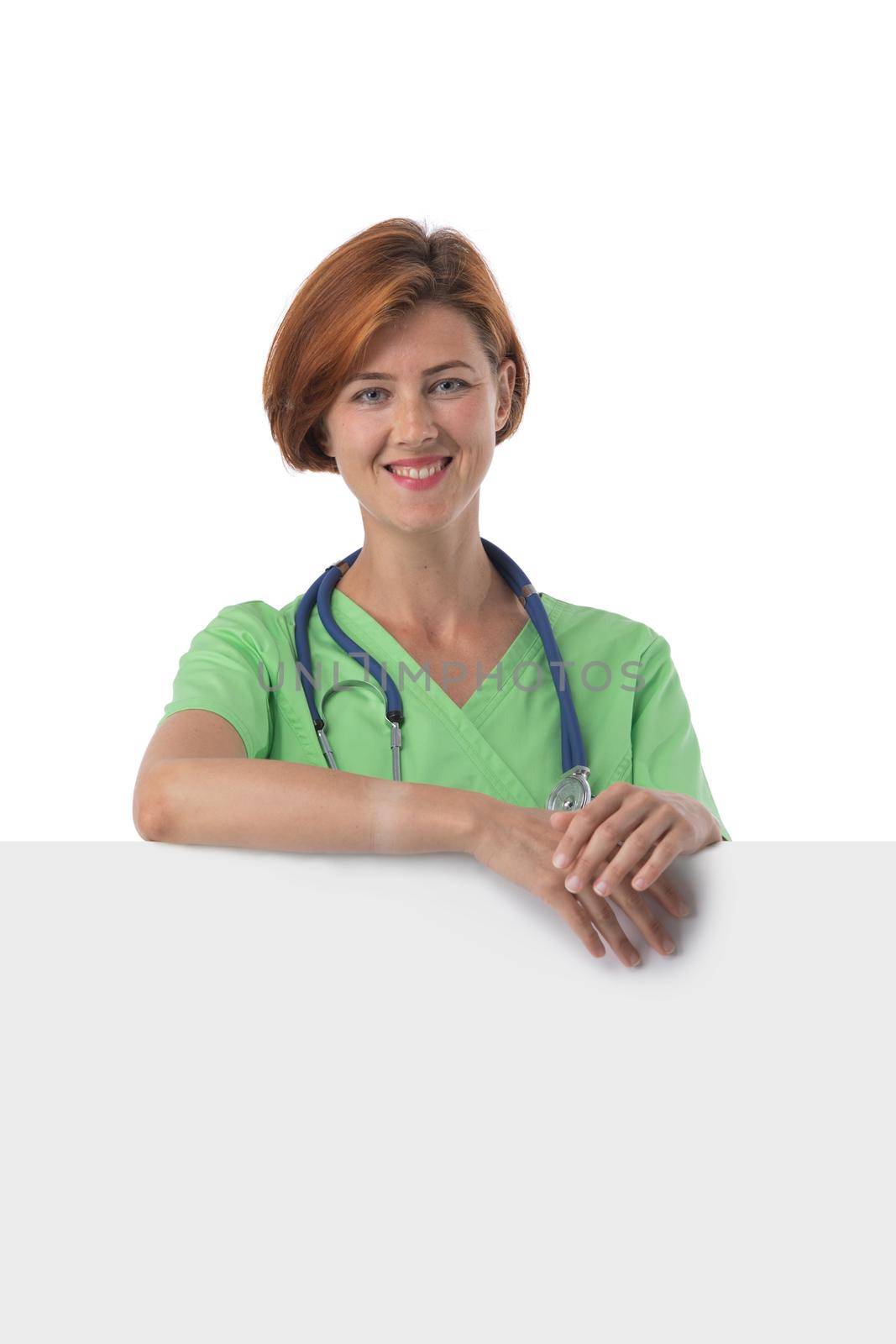 Medical doctor woman smile with stethoscope hold blank card board with copy space, concept of advertisement product, nurse wear green surgery suit Isolated over white background