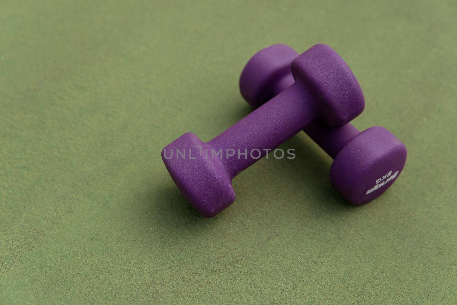 close-up. purple dumbbells by Alexzhilkin