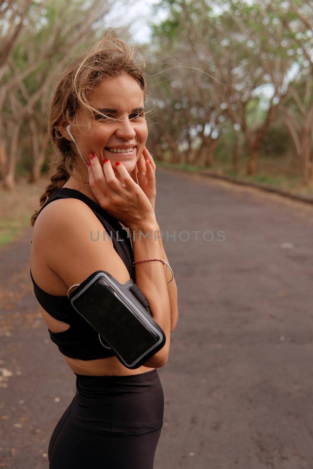 beautiful woman listening to music in the park