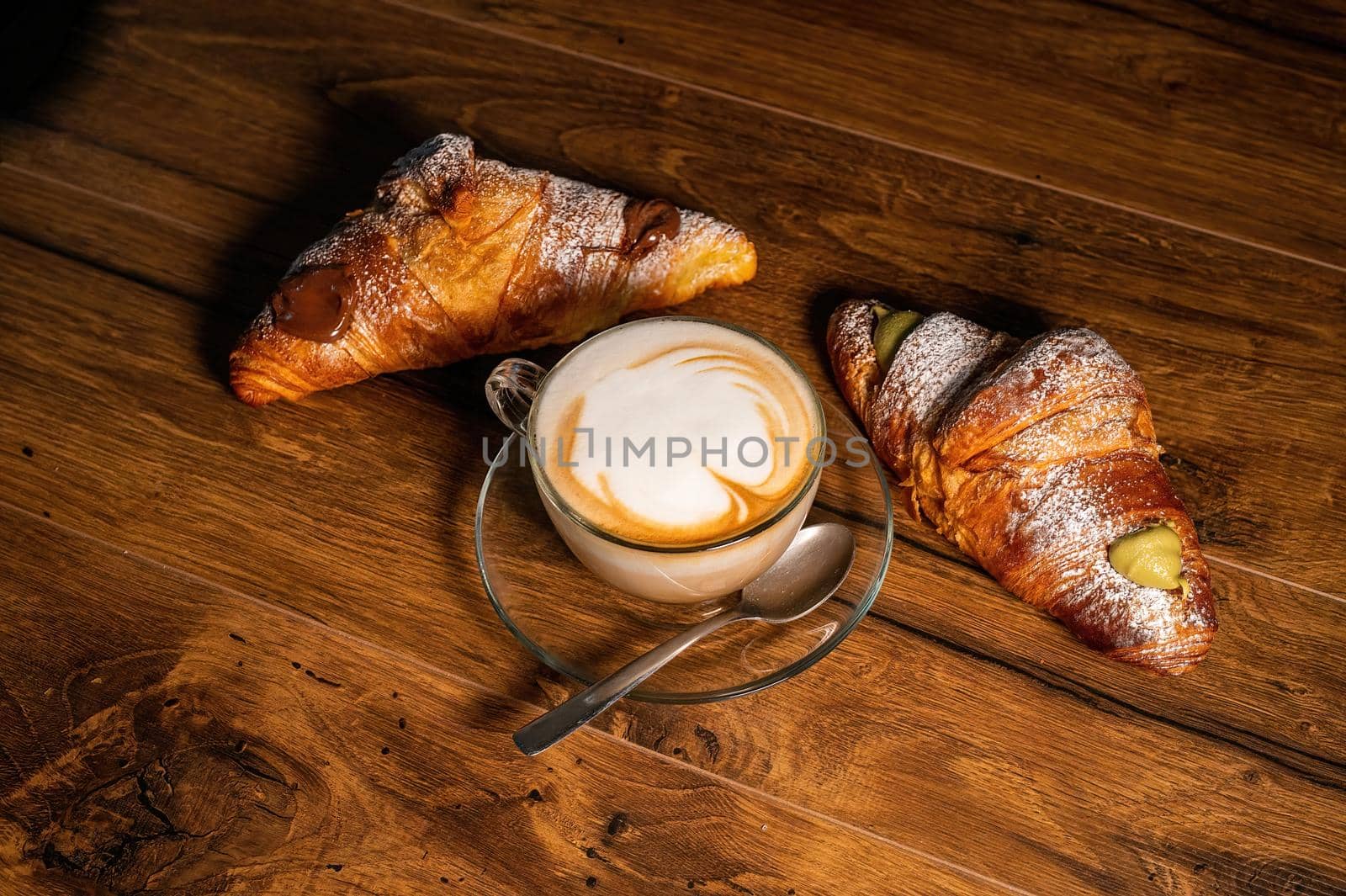 sweet croissants with cream and cappuccino by carfedeph