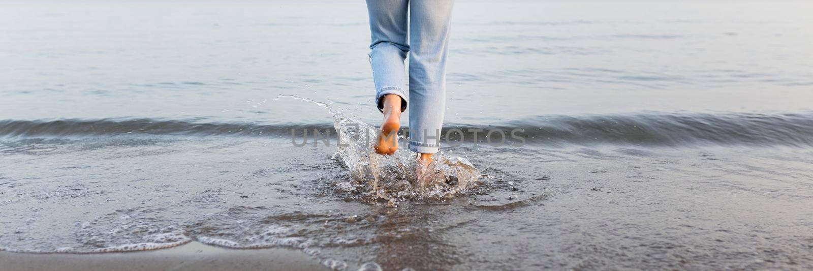 woman getting into sea. High resolution photo