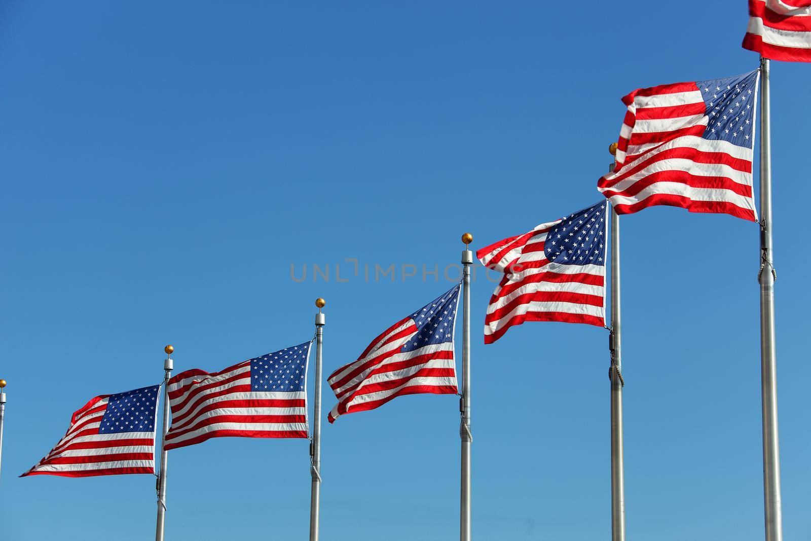 Some USA Flags at the Washington Monument blowing in the wind