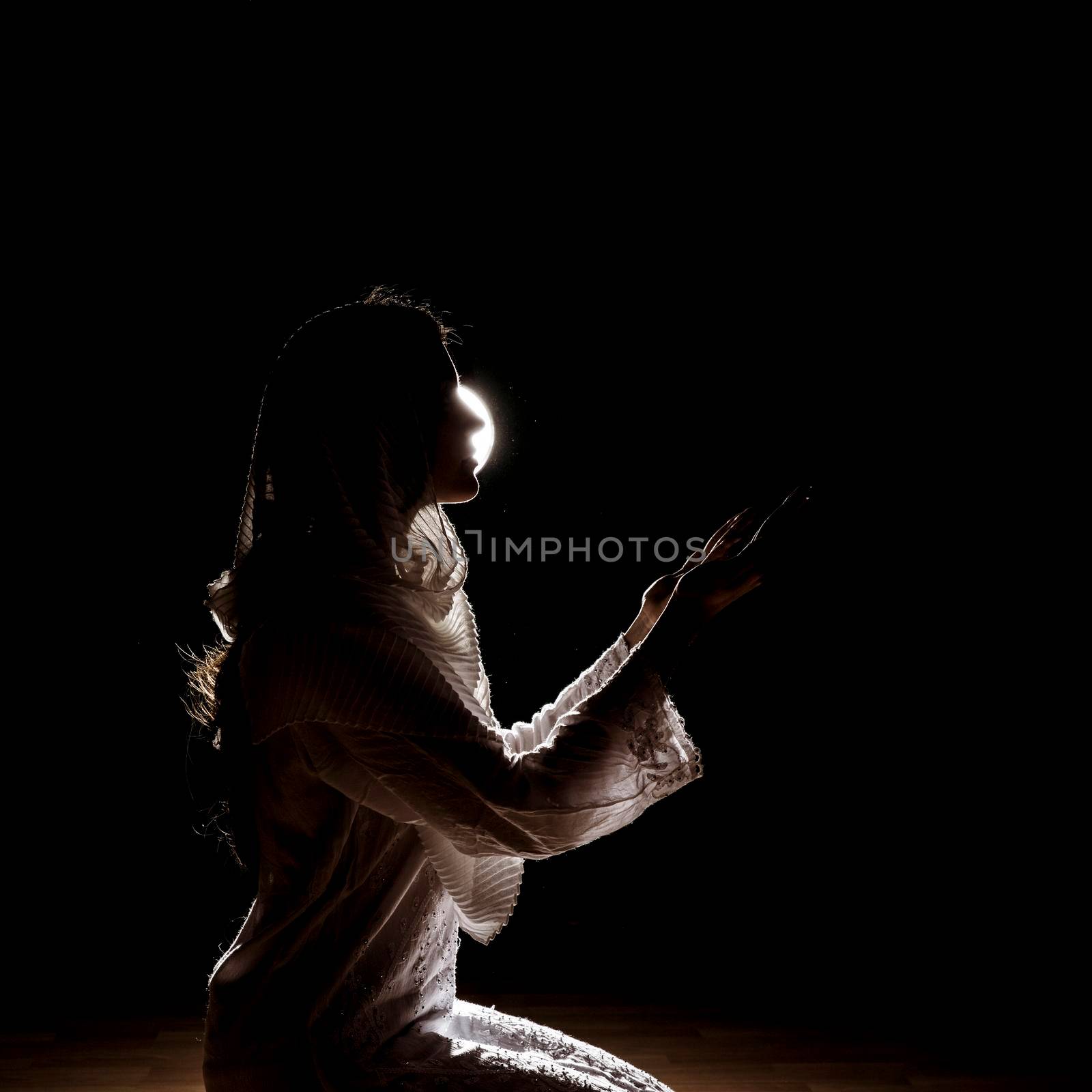 silhouette muslim woman praying. High resolution photo