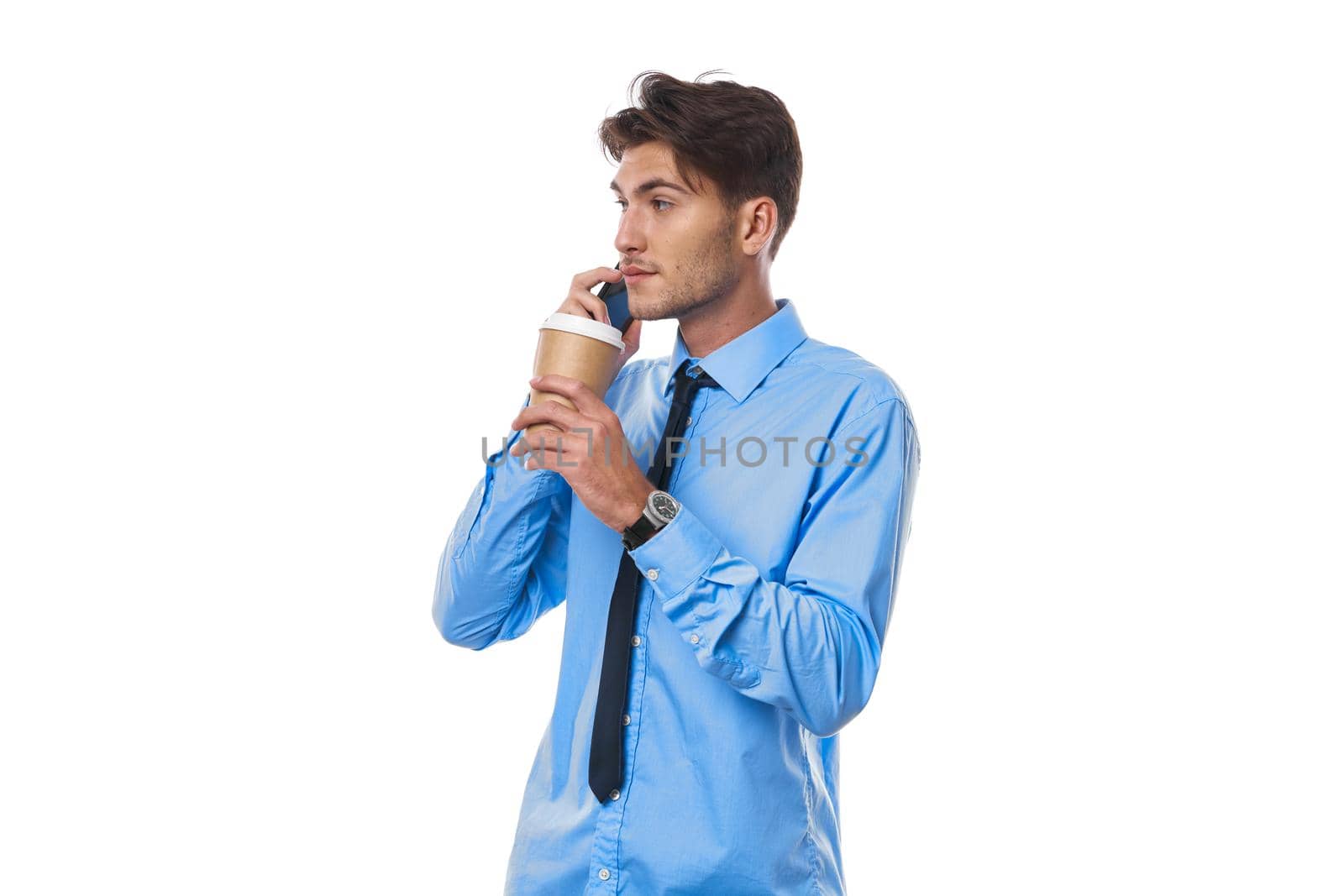 man in shirt with tie coffee cup posing office light background. High quality photo