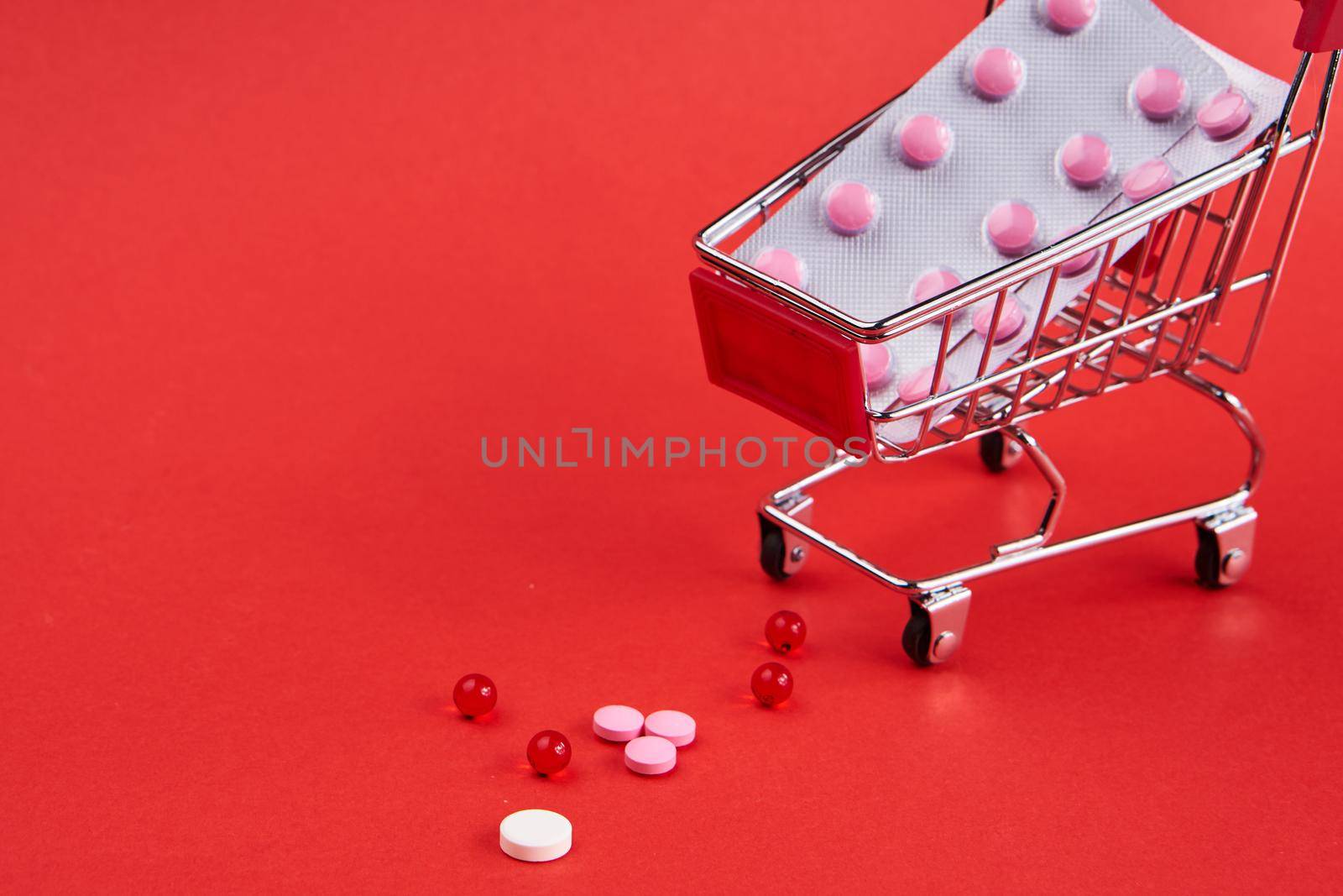 small trolley with medicines pharmacy shop pills shopping by Vichizh