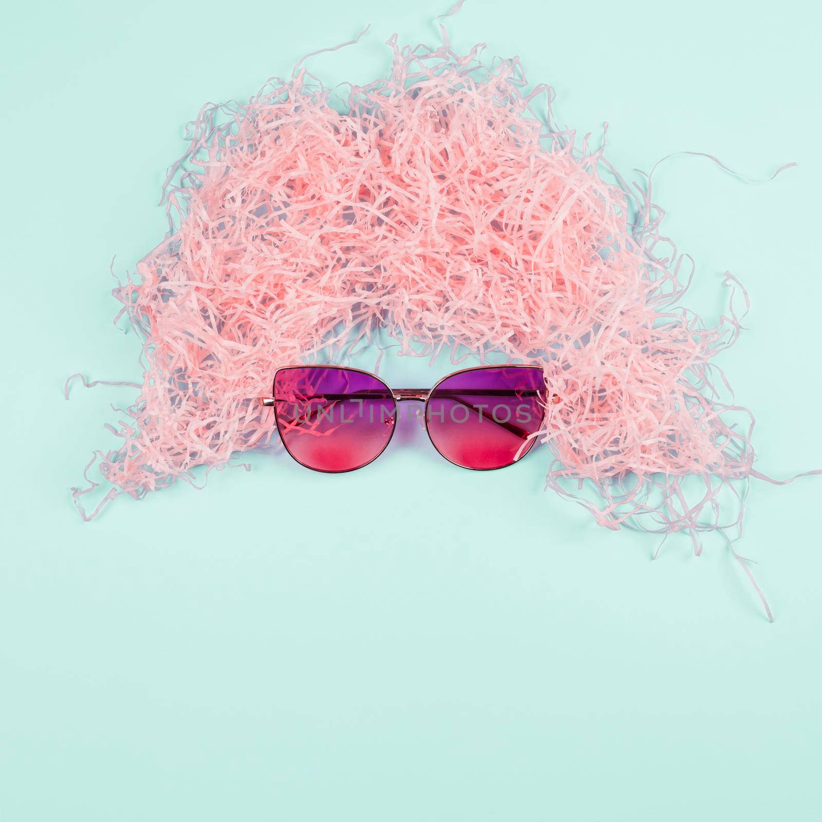 pink shredded paper wig sunglasses mint background. High quality photo by Zahard