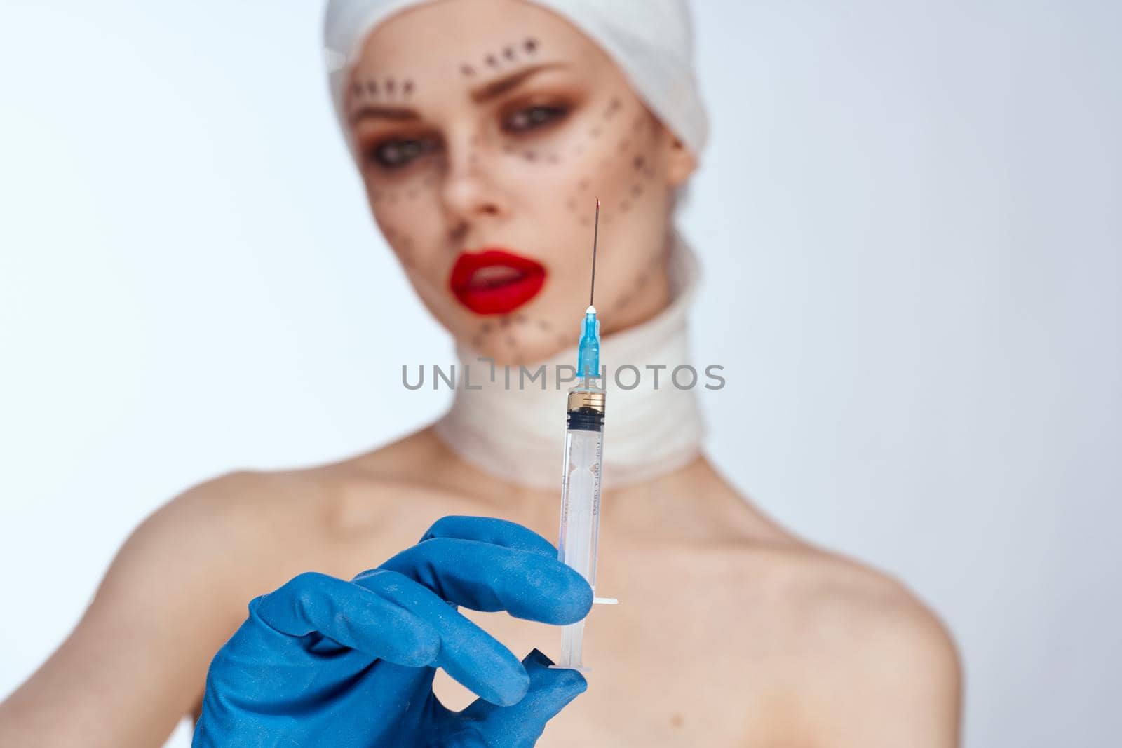 woman Red lips plastic surgery operation bare shoulders studio lifestyle. High quality photo