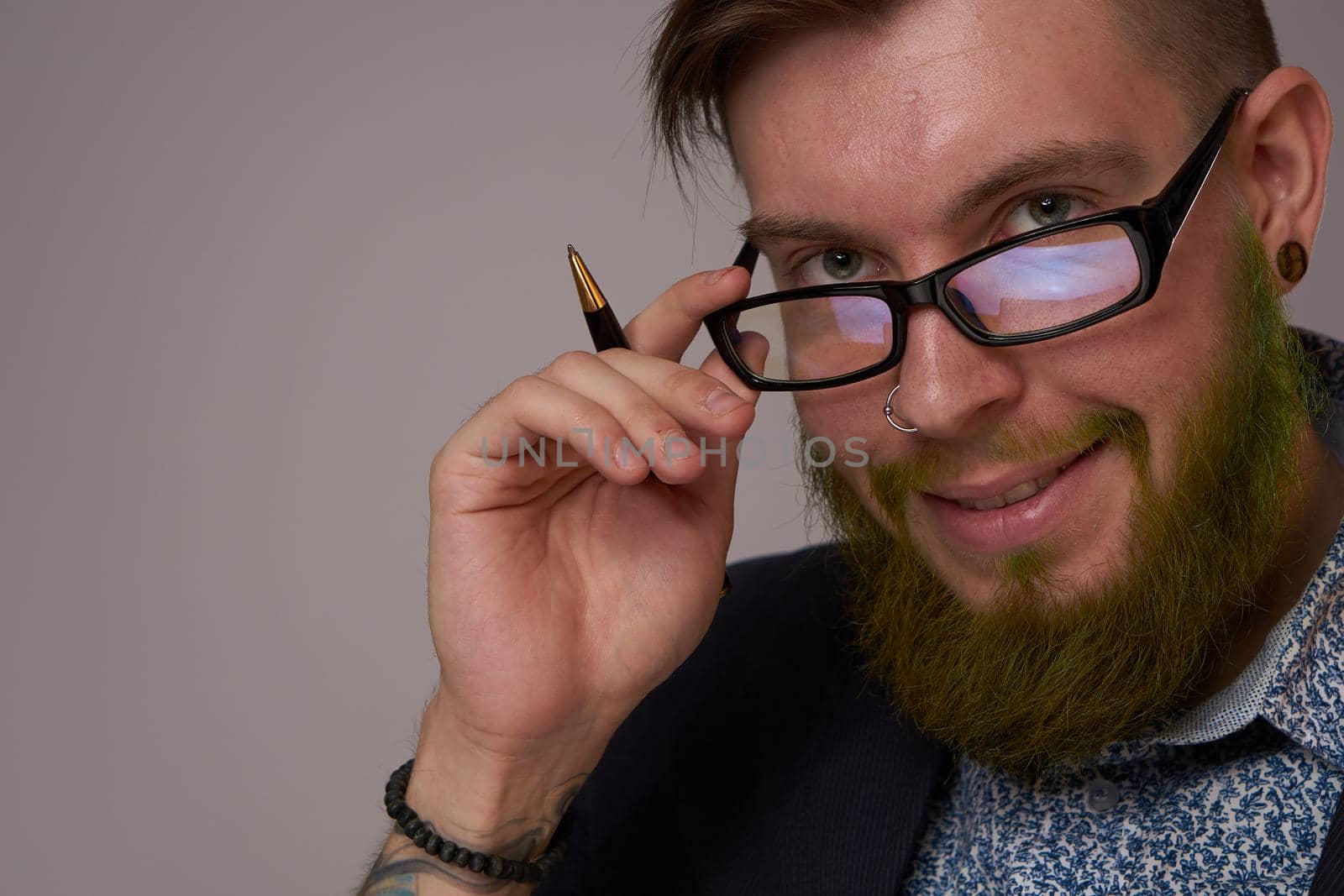 portrait of a business man wearing glasses with a beard posing an official. High quality photo