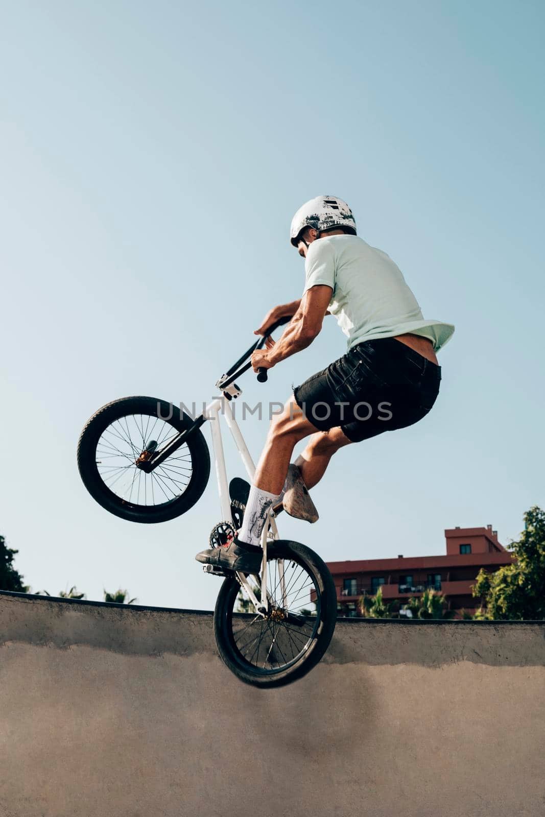 young man extreme jumping with bicycle. High resolution photo