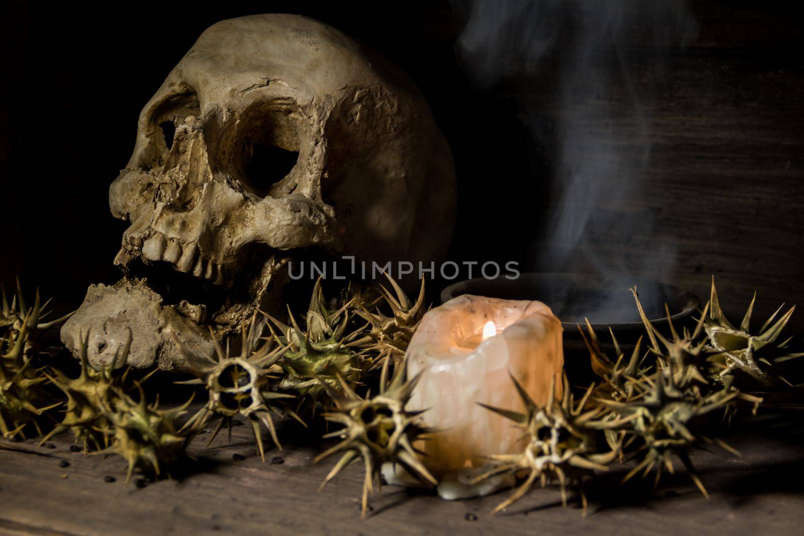 burundanga with a human skull fire and smoke. Shamanic ritual