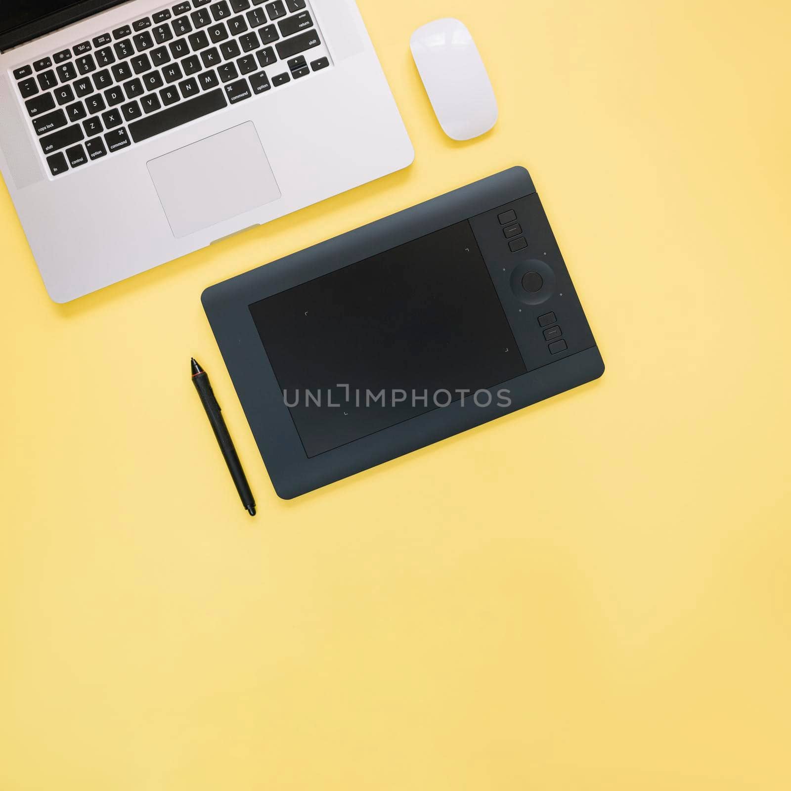 elevated view graphic digital tablet laptop yellow background. High quality photo by Zahard