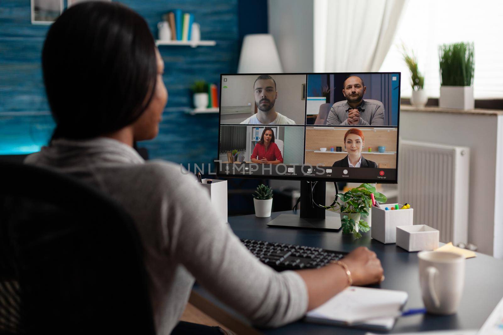 Worker using video call communication with colleagues to do business meeting and remote work on computer. Adult talking about project on online video conference on internet connection.