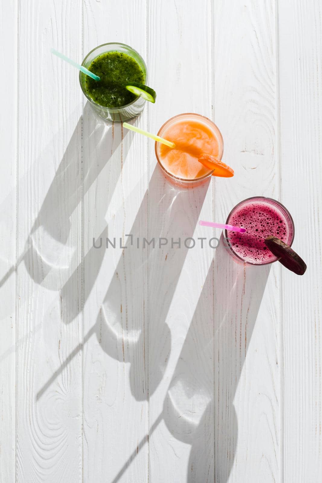 fresh healthy juices with straws. High resolution photo