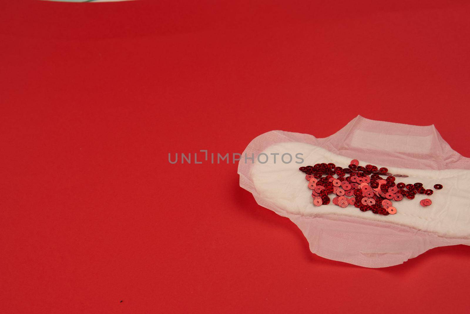 feminine pad blood menstruation hygiene red background. High quality photo