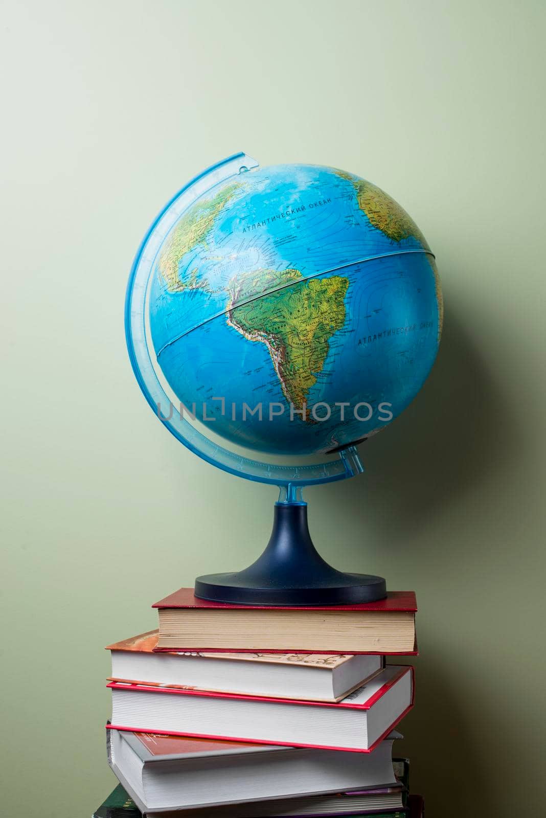 stacked books with globe. High resolution photo