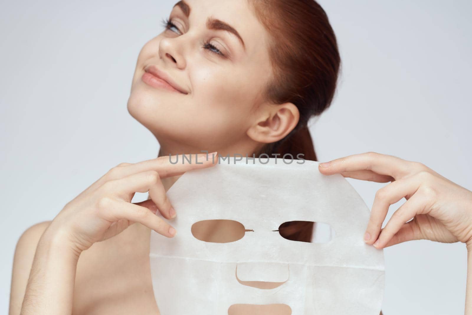 woman with mask in hands skin care rejuvenation spa treatments by Vichizh