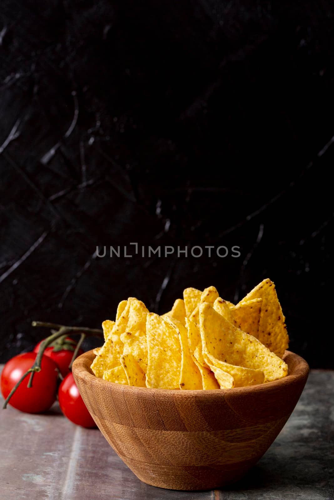 tasty nachos wooden bowl tomatoes. High resolution photo