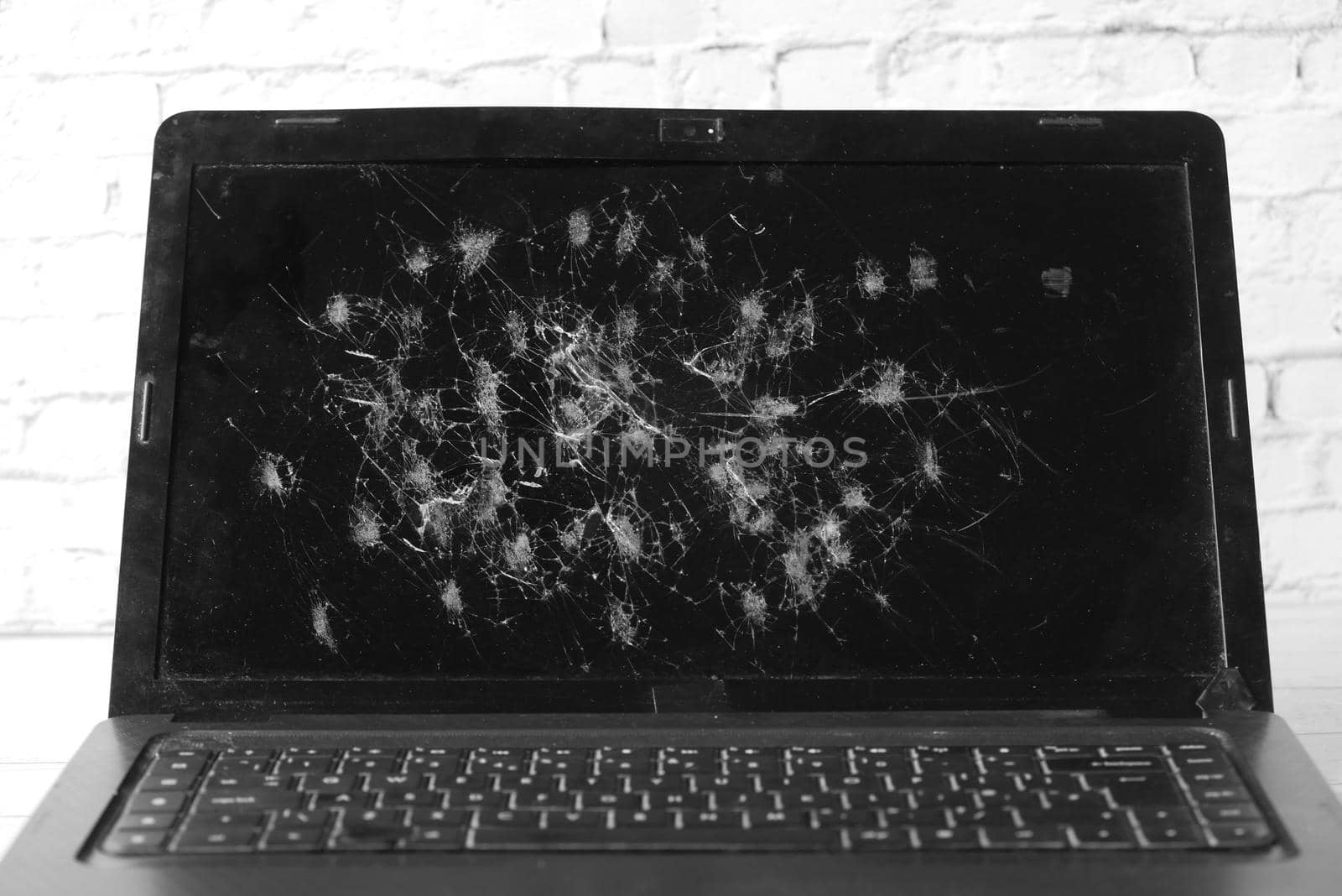 broken laptop screen on table close up .