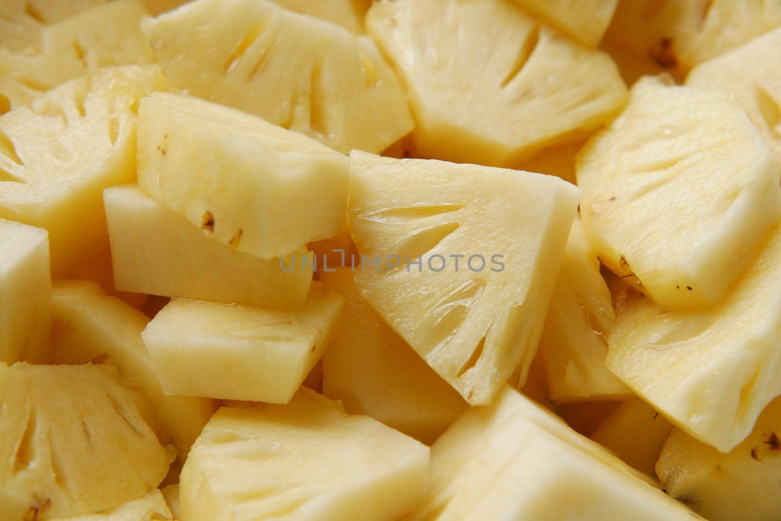 slice of pineapple in bowl on table .