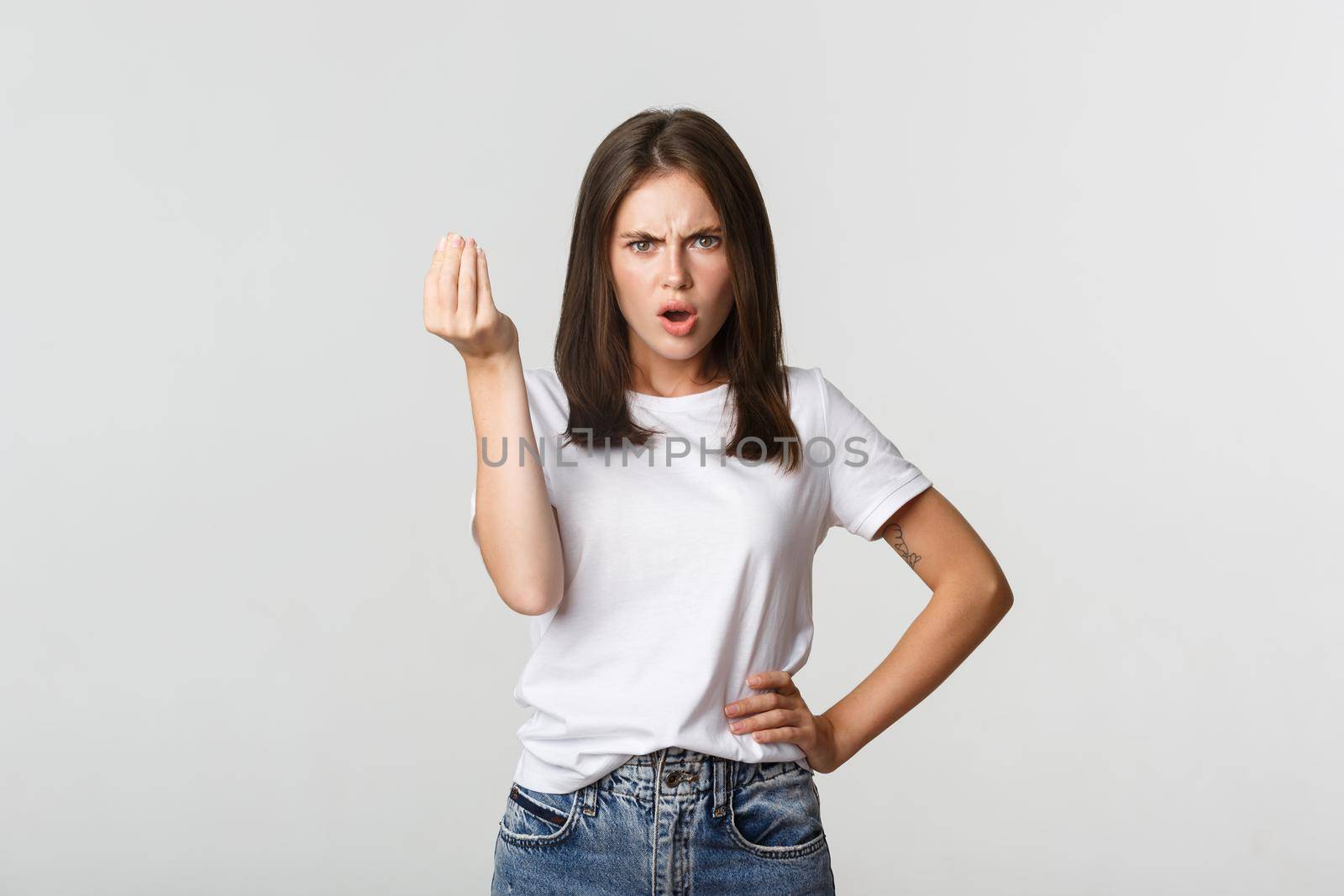 Confused and angry brunette girl arguing about money by Benzoix