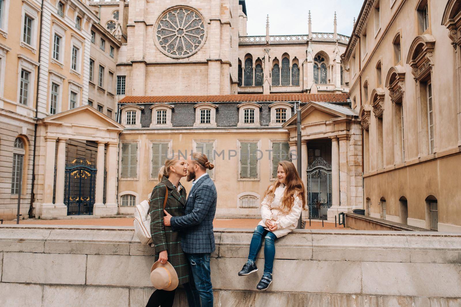 A beautiful family with strolls through the old city of Lyon in France.Family trip to the old cities of France.