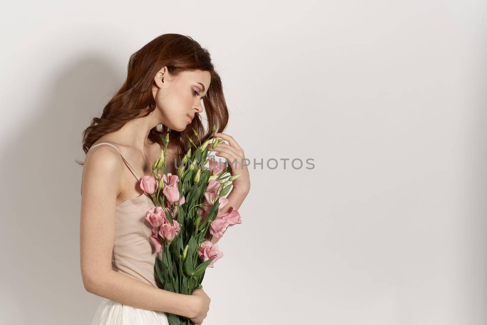 cheerful woman with a bouquet of flowers lifestyle glamor. High quality photo