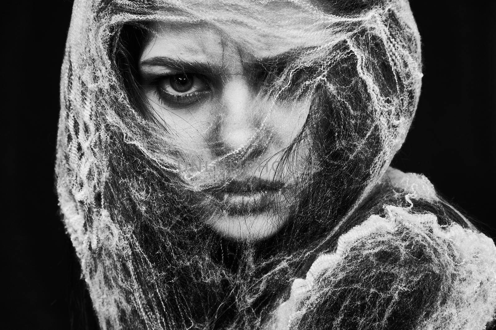 woman close-up in halloween costume spider web emotions. High quality photo