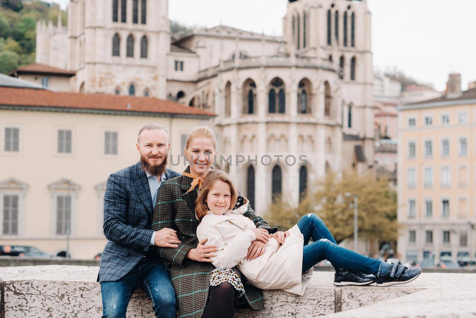 A beautiful family with strolls through the old city of Lyon in France.Family trip to the old cities of France by Lobachad