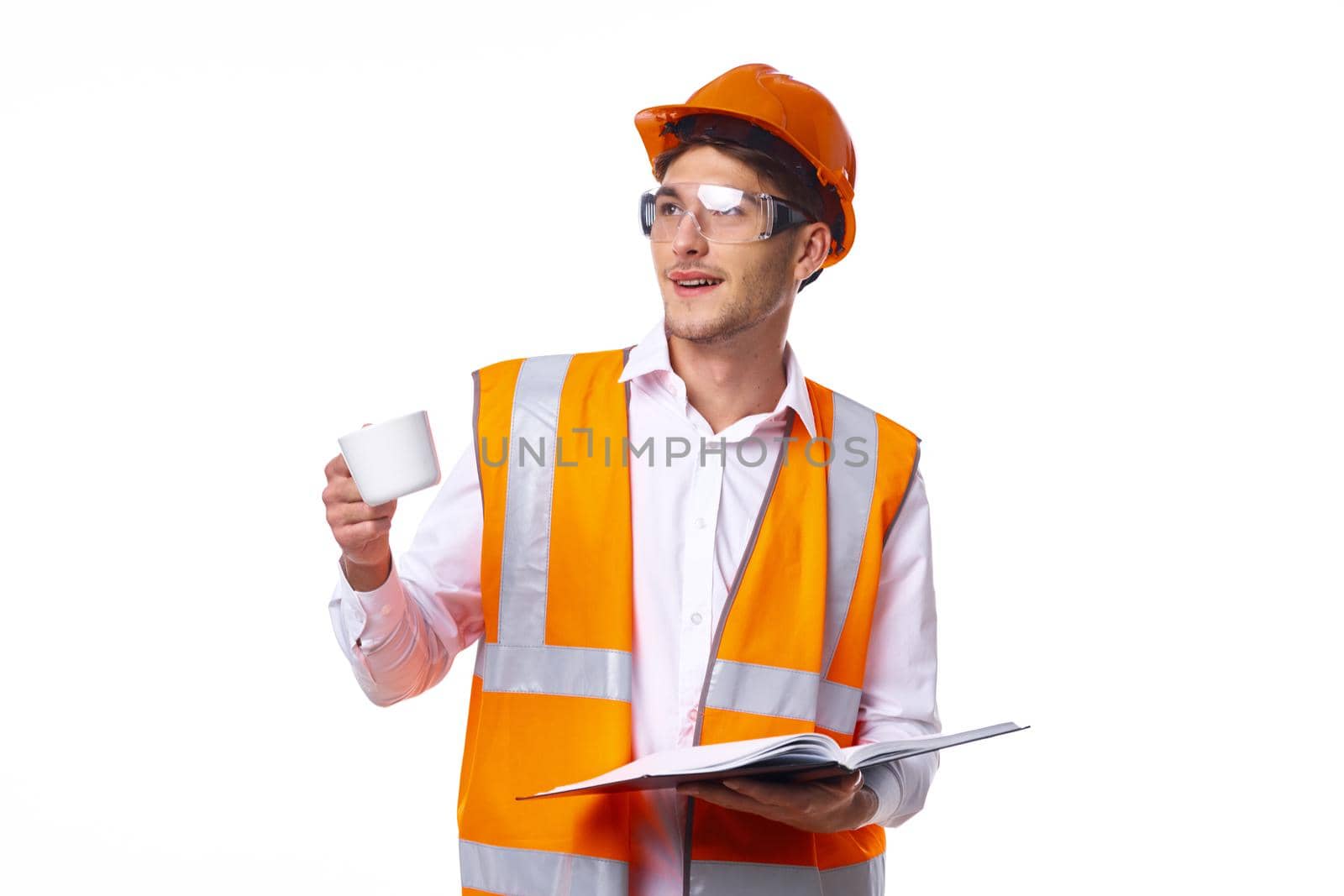man in work uniform orange helmet safety professional work. High quality photo