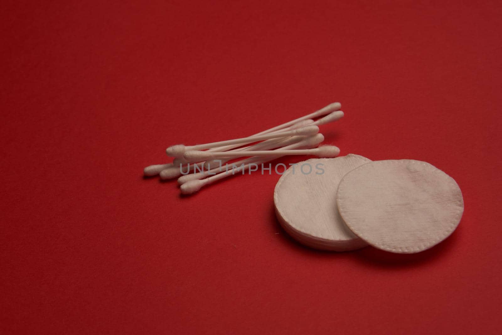 cotton swabs hygiene accessories care red background. High quality photo