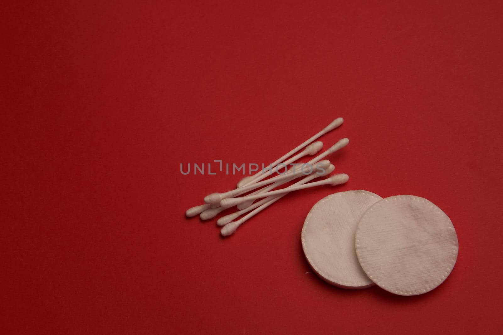 cotton swabs hygiene accessories care red background. High quality photo