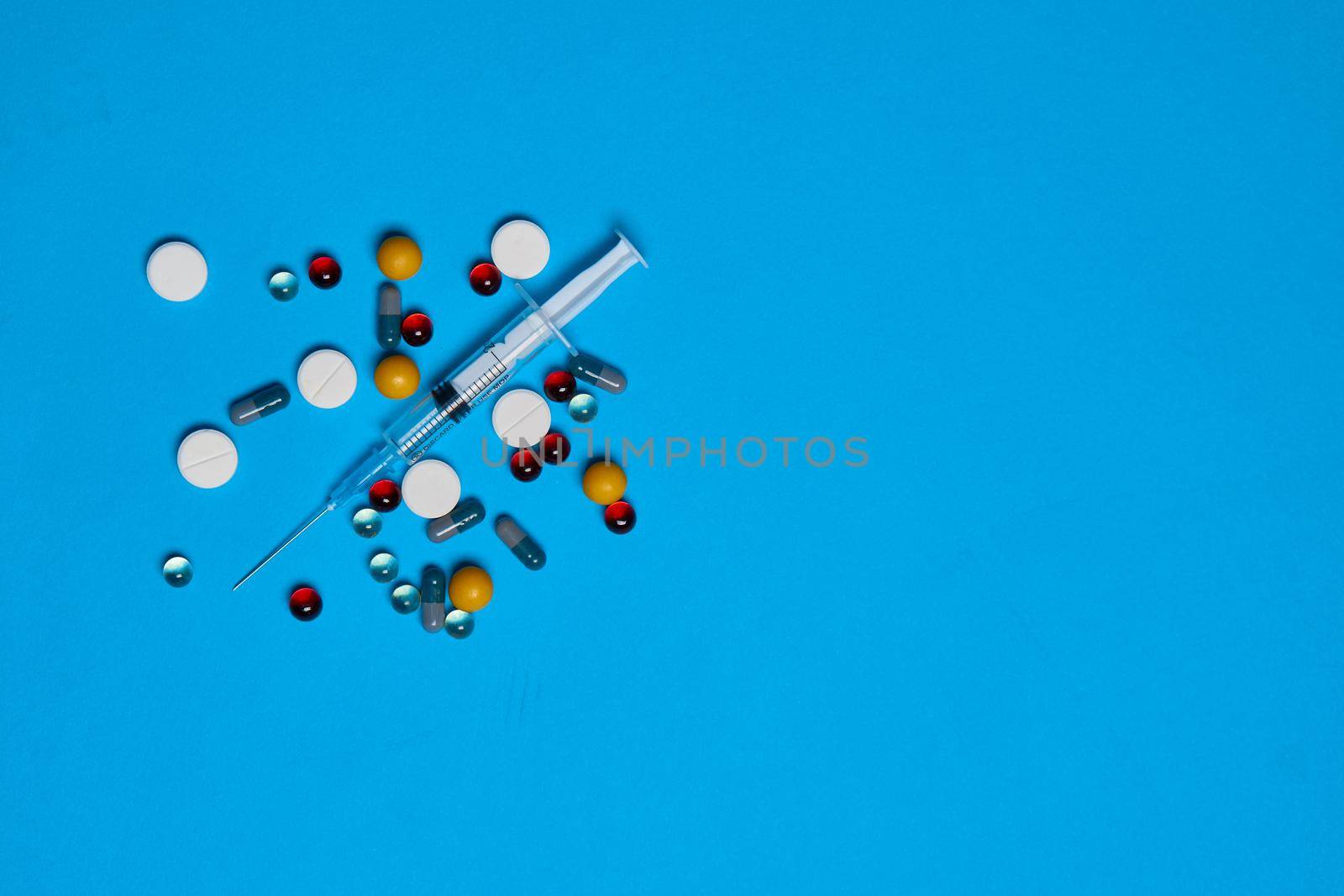 medicine jar vitamins capsules medicine blue background. High quality photo