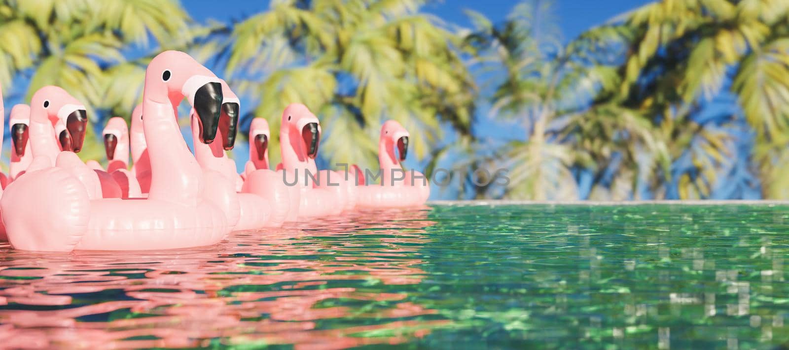 tropical pool filled with flamingo floats with palm trees behind by asolano