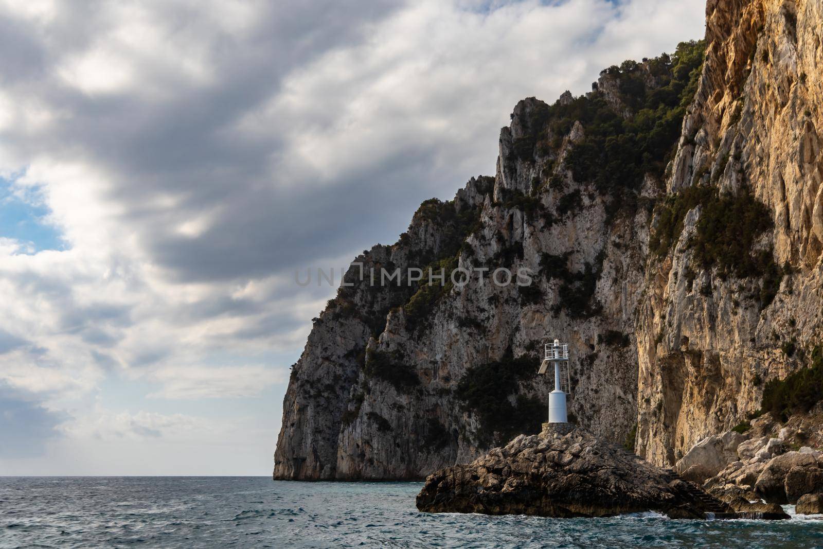 Edge of high cliff next to the sea at sunny day on Capri island