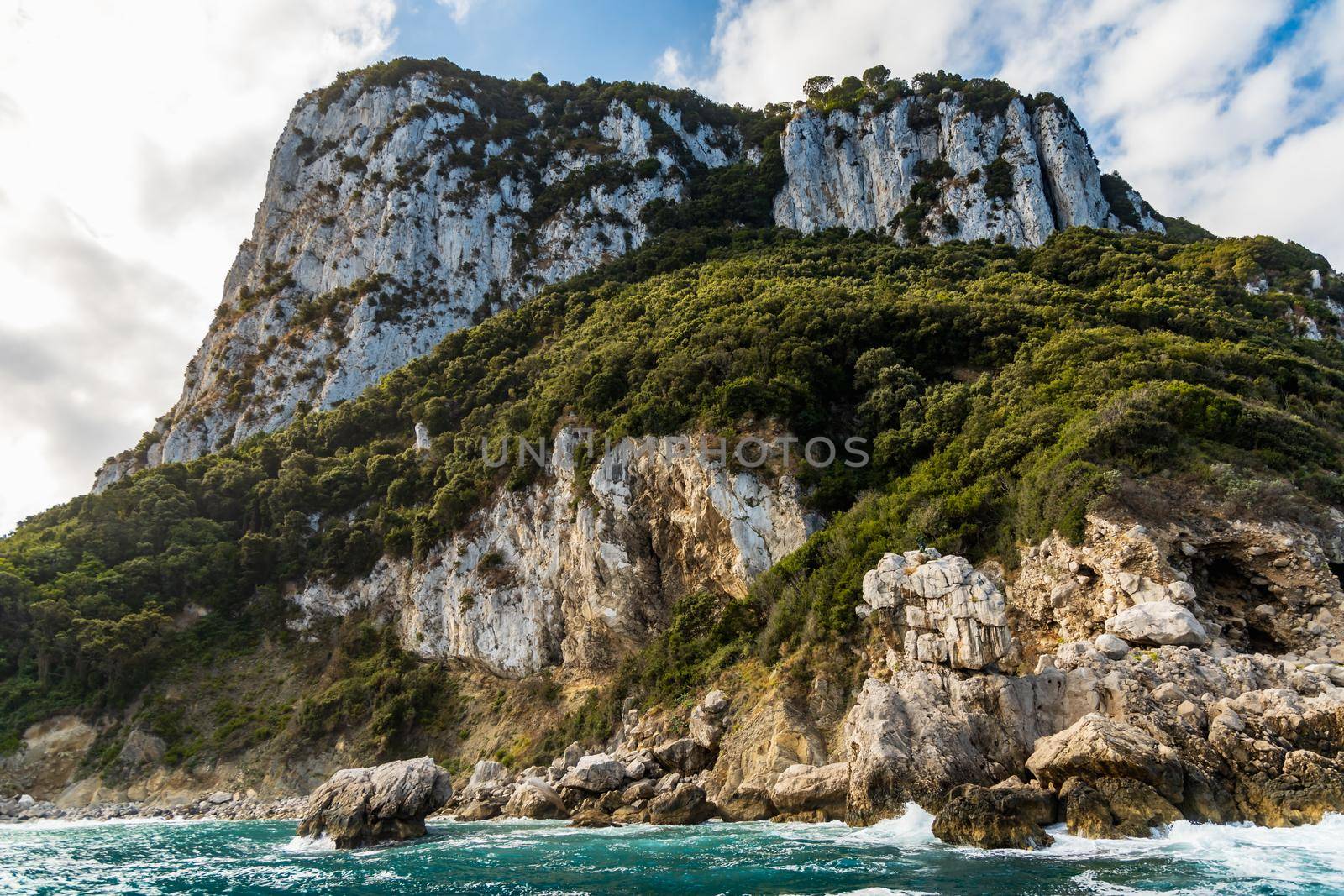 Silhouette of Capri island on Tyrrhenian Sea in Italy seen from boat